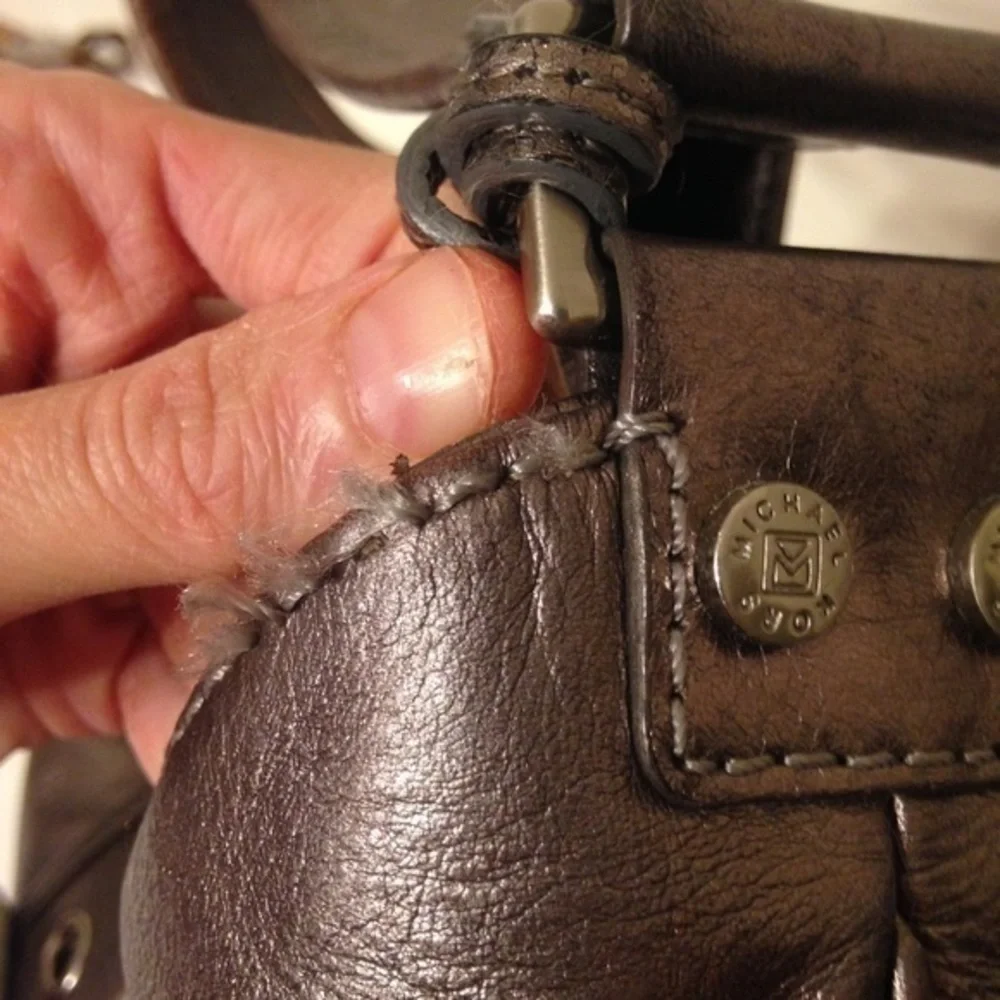Michael Kors silver metallic hobo bag buckle